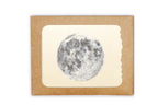 Framed print of a moon illustration on a beige background