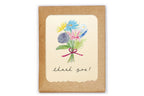 Card with floral design and 'thank you!' text on a white background