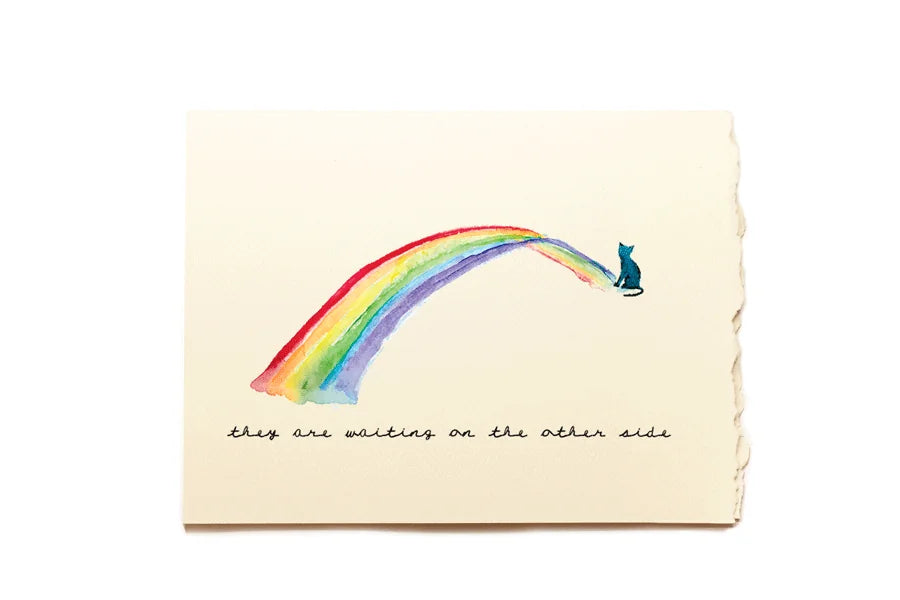 Note card with a rainbow and a cat on a beige background