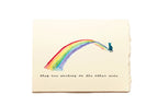 Note card with a rainbow and a cat on a beige background