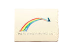 Note card with a rainbow and dog illustration on a beige background