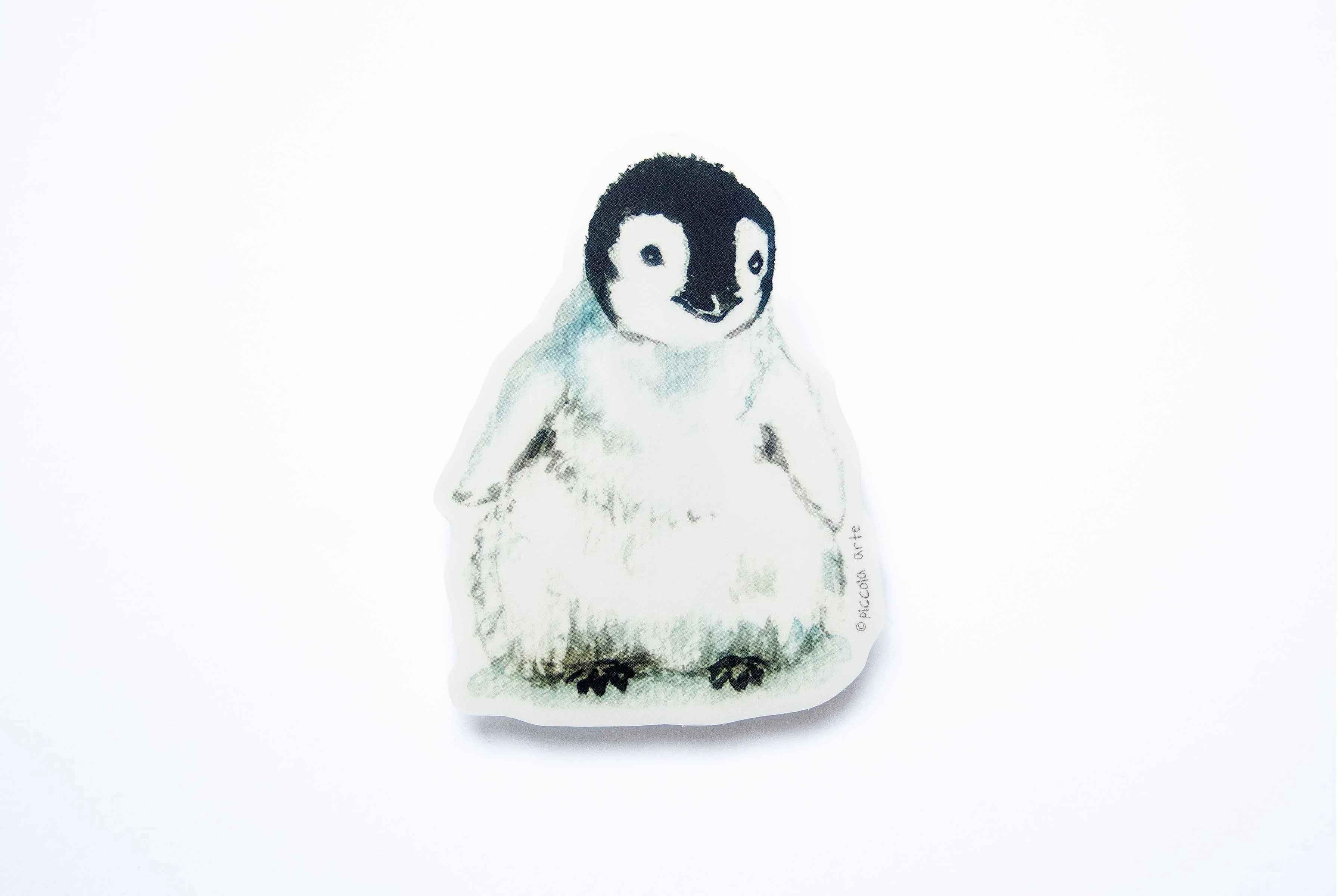 Stcker of a penguin on a white background.