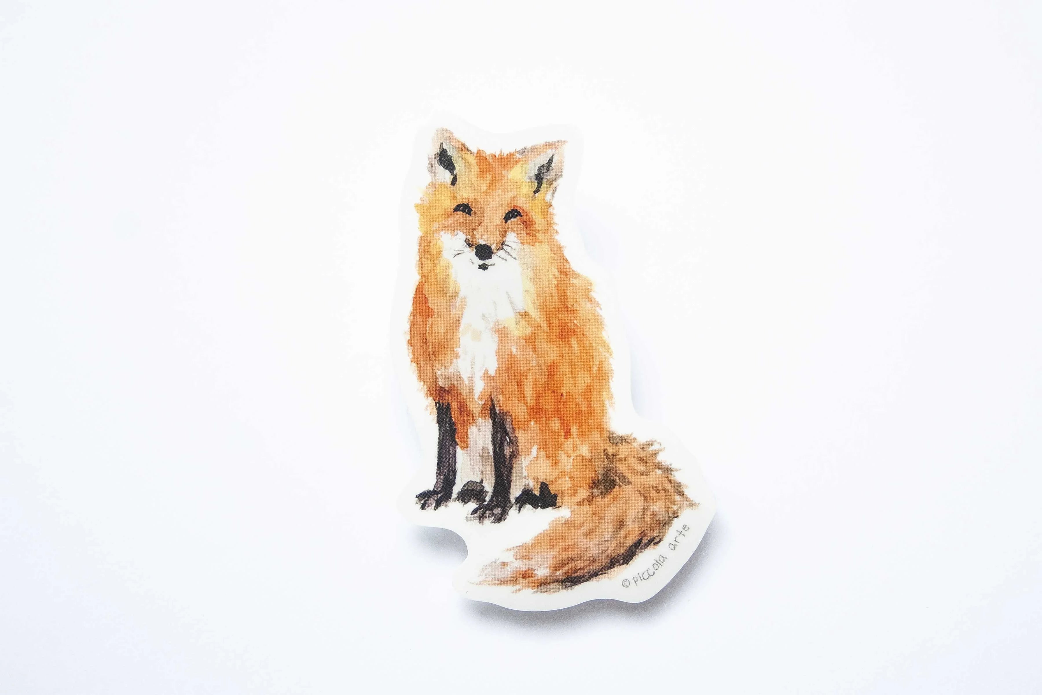 Sticker of a fox on a white background.
