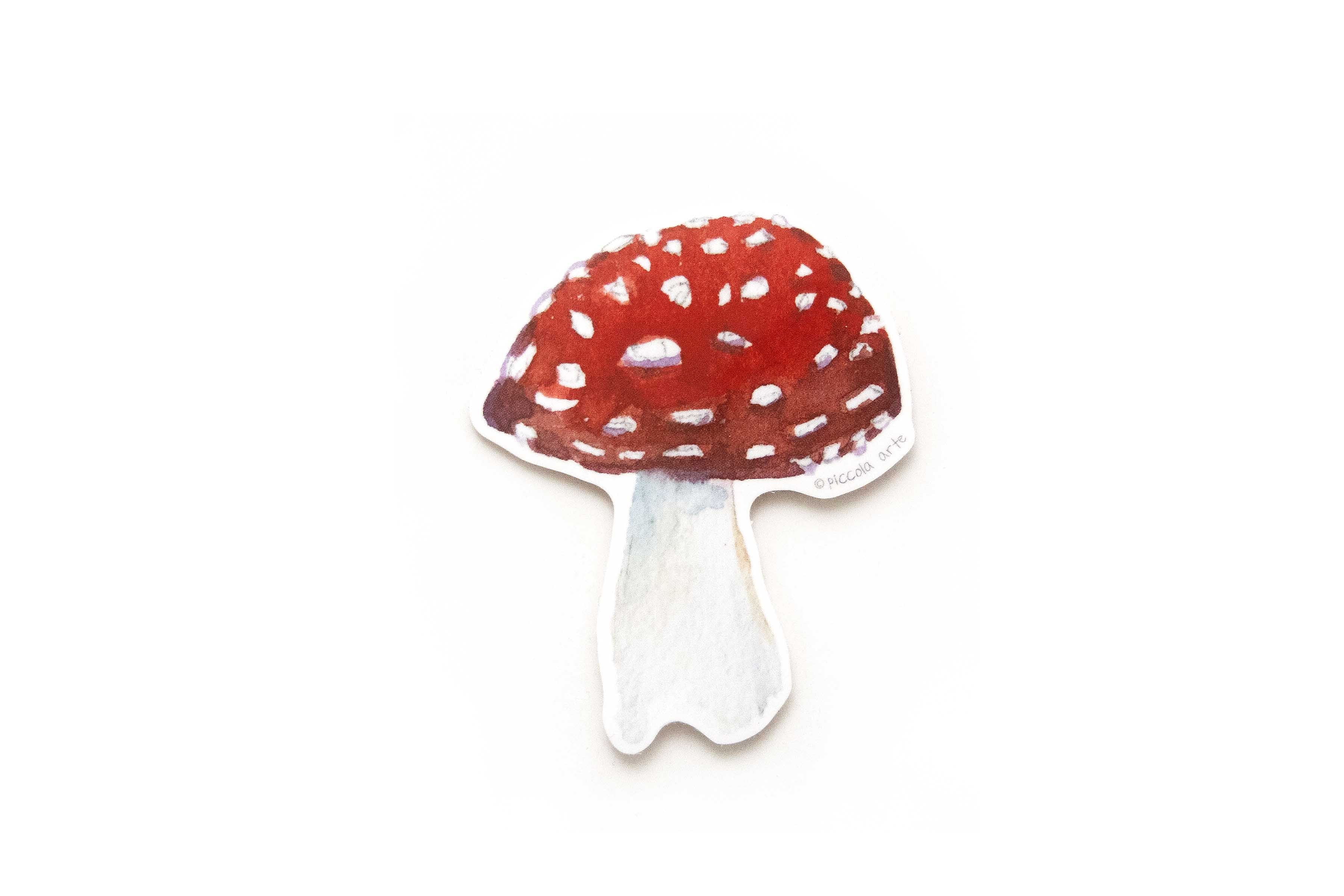 Sticker of a red mushroom with white spots on a white background