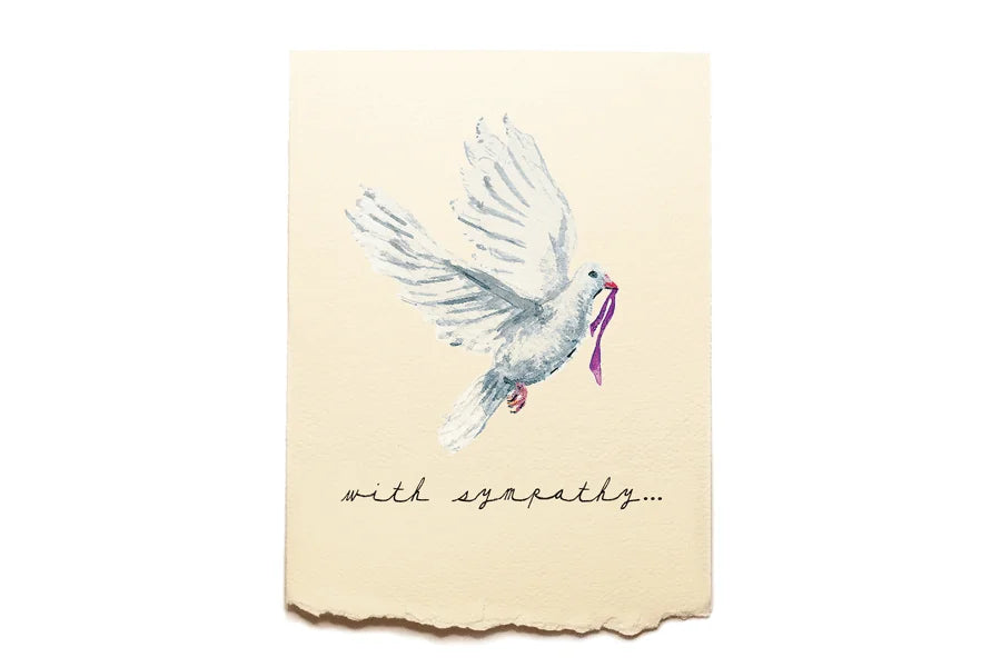 White dove with a purple ribbon on a beige card with 'with sympathy' text