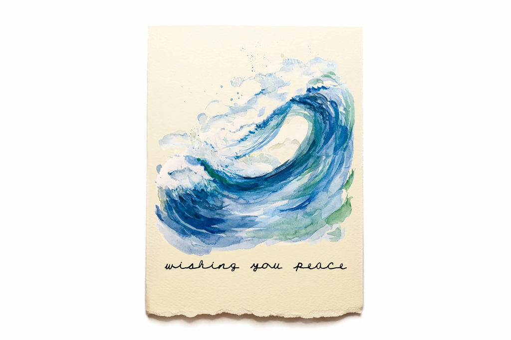 Card with blue wave design and 'wishing you peace' text on a beige background