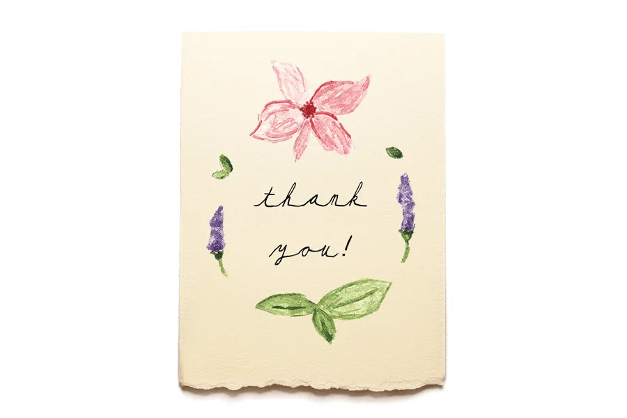 Note card with floral illustrations and 'thank you!' text on a white background