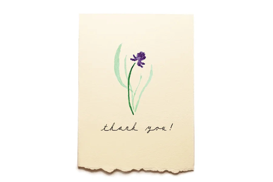 Beige card with a purple flower illustration and 'thank you!' text on a white background