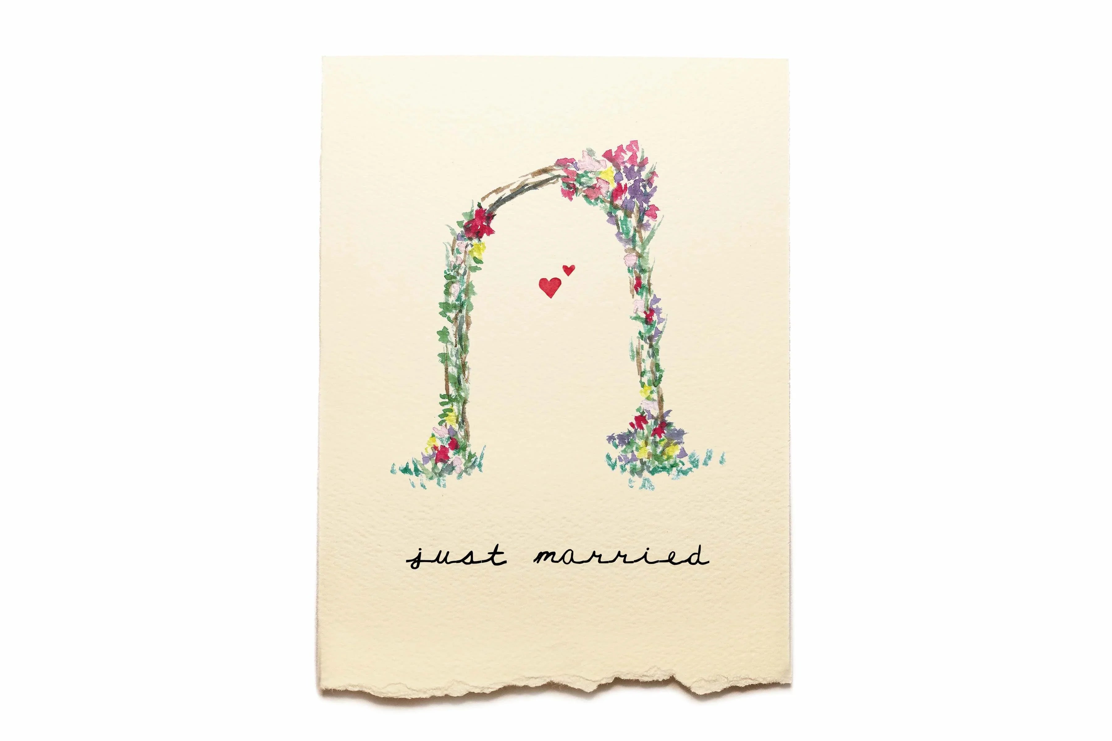 Floral arch with 'just married' text on a beige background