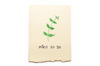 Beige towel with green leaf design and 'mint to be' text on a white background